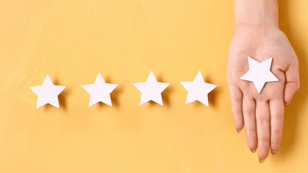 星マークと人の手